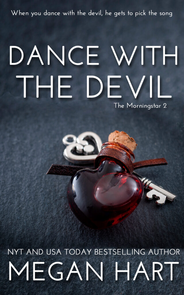 a heart shaped bottle filled with blood and a key behind it on a gray background