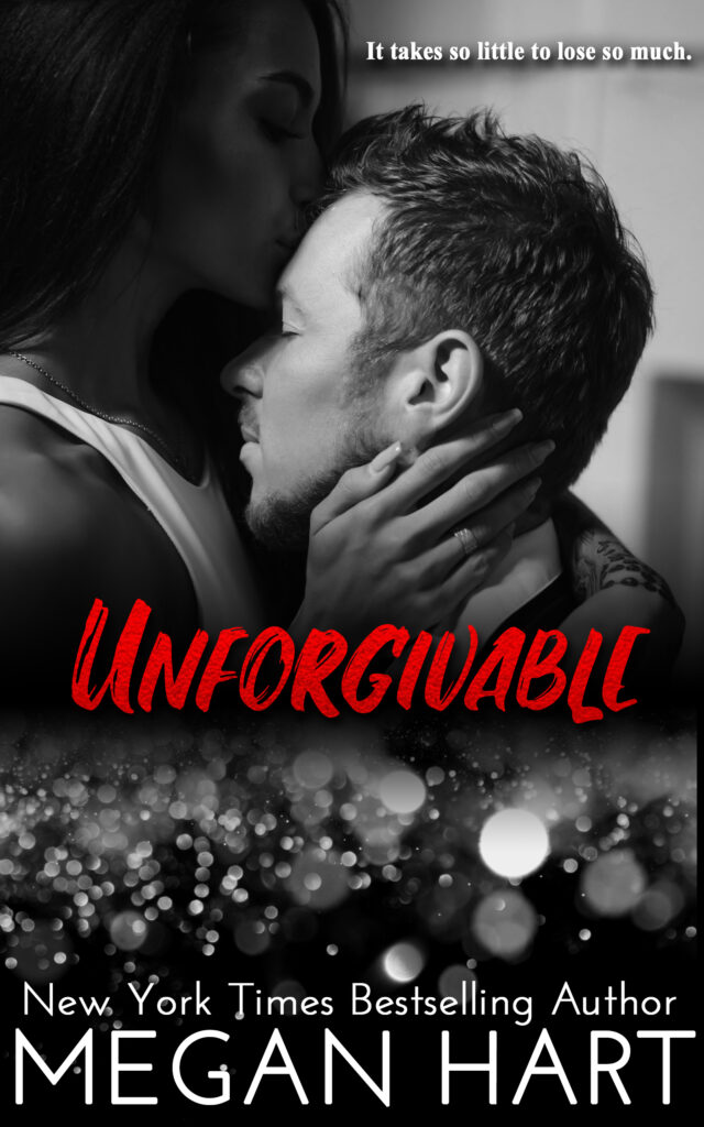 a woman sensually kissing a man on the forehead